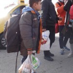 20151217 around 10AM refugees are blissful happy to receive our foods and flyers at Pireaus harbor in Athens Greece (88)