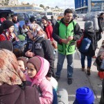 20151217 around 10AM refugees are blissful happy to receive our foods and flyers at Pireaus harbor in Athens Greece (92)