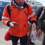 20151217 around 10AM refugees are blissful happy to receive our foods and flyers at Pireaus harbor in Athens Greece (93)
