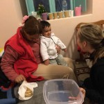 Volunteer helps to serve food