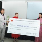 Ms. Maneka Gandhi (right) receives Supreme Master Ching Hai’s contribution of US$20,000 to further Ms. Gandhi’s noble work