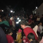 Refugees and volunteers dancing