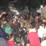 Refugees and volunteers dancing