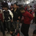Refugees dancing to their music