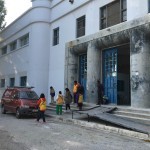 team in front of building