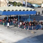 Refugees lining up in Chios port ready to embark the ferryboat for Athens