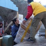 Unloading relief items at Lighthouse Refugee rescue point - with coordinator David