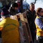 Unloading relief items at Platanos rescue point - giving the volunteers the wooden pallets
