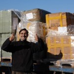 Unloading relief items at Platanos rescue point - with Nikos - very happy to receive items
