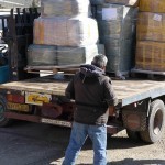 Uploading pallets of relief items onto transport truck