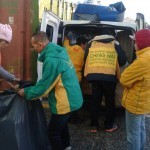 Distributing Jackets, Pants and Shoes at Piraeus Harbour in Athens, Greece