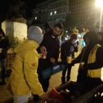 Serving hot vegan meal to refugees at Victoria Square, Athens, Greece