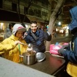 Serving hot vegan meal to refugees at Victoria Square, Athens, Greece
