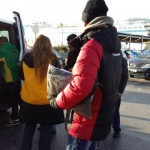 Refugees Standing in Line to Get Jackets, Pants and Shoes at Piraeus Harbour in Athens, Greece