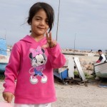 Syrian girl at Souda refugee Camp, Chios Island, Greece, wanting her photo to be taken