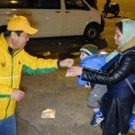 Distributing vegan food packages at the port, Athens, Greece - Feb. 11, 2016