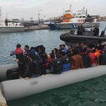 Helping refugees getting out of boat