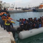 Helping refugees getting out of boat