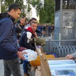 Providing relief items to refugees in Victoria Park, Athens, Greece