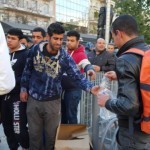 Providing relief items to refugees in Victoria Park, Athens, Greece