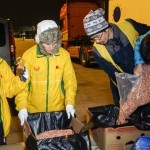 Distributing vegan food packages at the port, Athens, Greece - Feb. 10, 2016