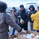 Providing vegan food packages to the refugees at Piraeus Port in Athens, Greece