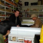 Purchasing shelter materials from local hardware store, Indomeni, Greece