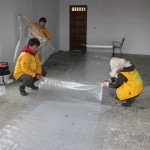 Cutting nylon covering for tents, Indomeni, Greece