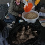Packing peanuts and raisins for distribution, Indomeni, Greece