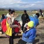 Giving toys to children, Idomeni, Greece