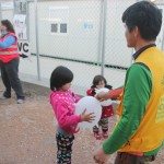New hotspot camp in Vial playing with kids after lunch distribution, Greece