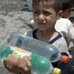 160591_Syrian Refugees in Gaza drinking water from farmers rebuilt well.jpg2